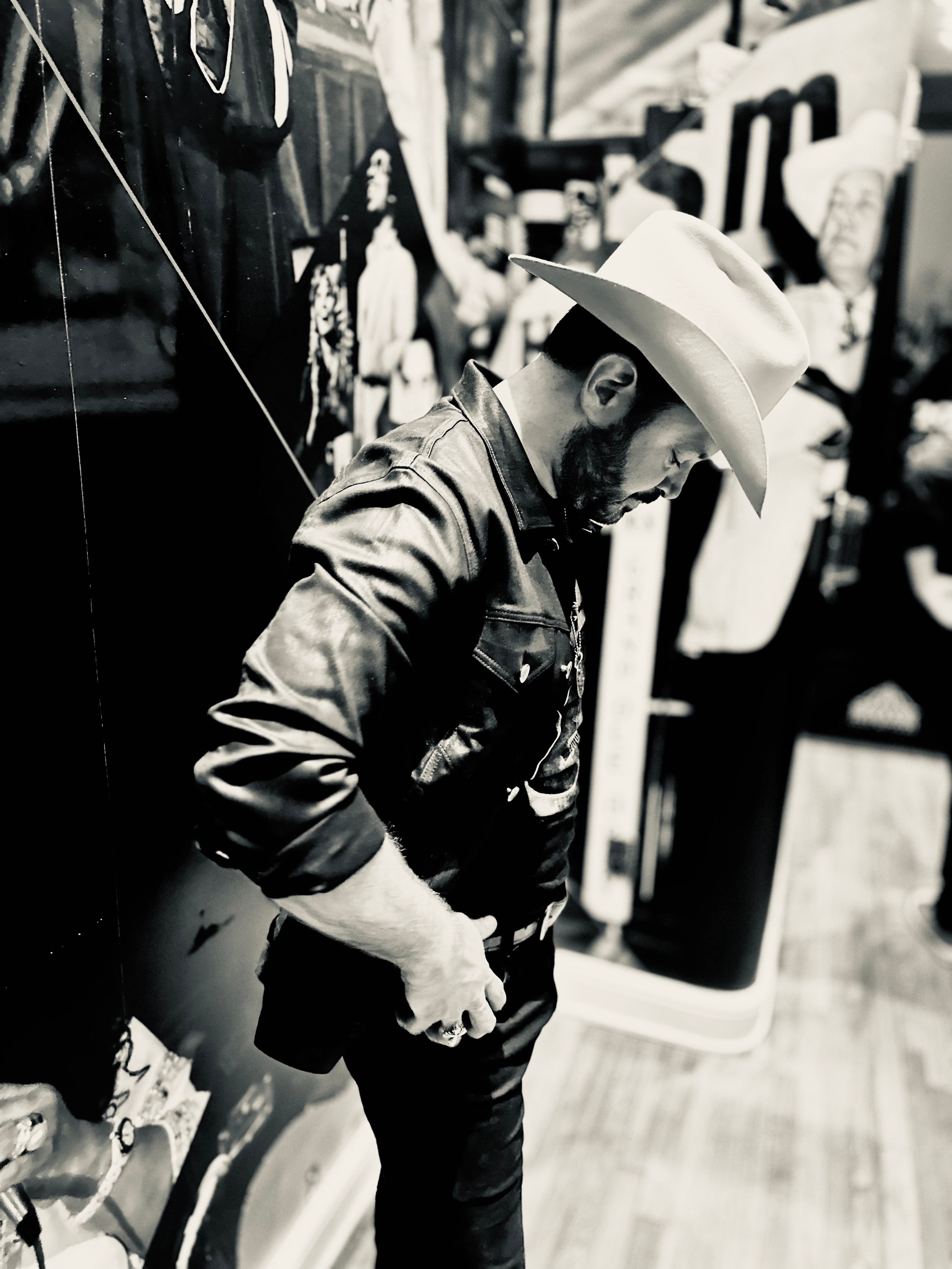 Black and white photo of Wade looking at the ground